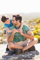 Father and son hiking through mountains