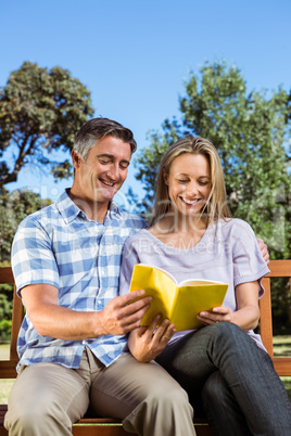 Couple relaxing in the park on bench