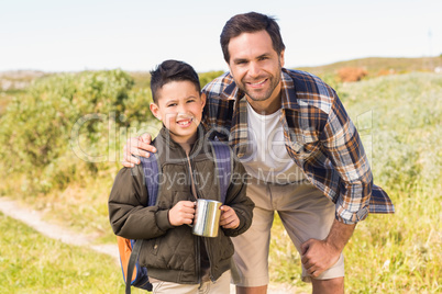 Father and son hiking in the mountains