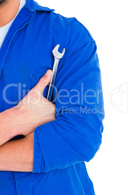 Male mechanic holding spanner on white background