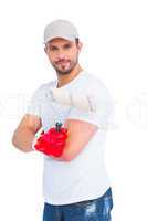 Handyman holding paint roller
