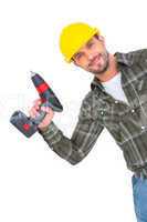 Smiling repairman with drill machine