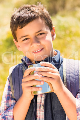 Little boy hiking in the mountains