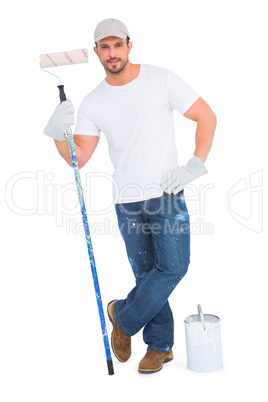 Handyman with paint can and roller