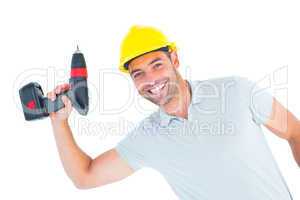 Smiling repairman holding power drill