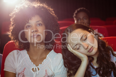 Young friends watching a film