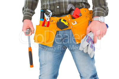 Manual worker holding gloves and hammer