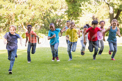 Happy friends running in the park