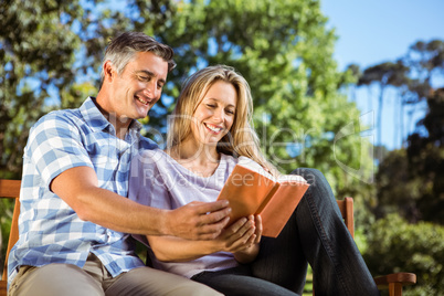 Couple relaxing in the park on bench