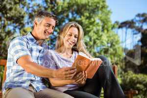 Couple relaxing in the park on bench