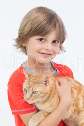 Portrait of cute boy holding cat