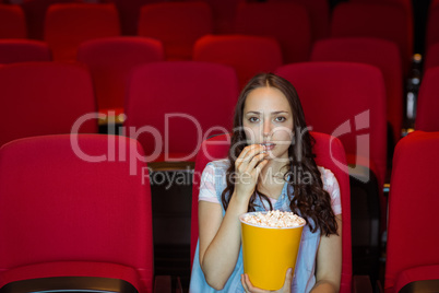 Young woman watching a film