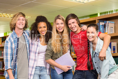 Cheerful college students in library