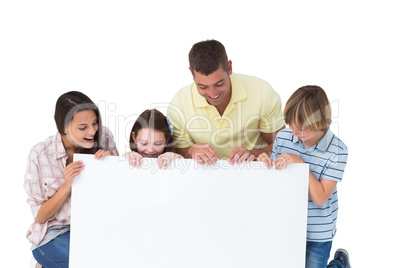 Family of four looking at billboard