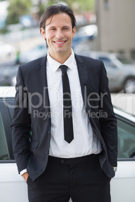 Businessman leaning on the door