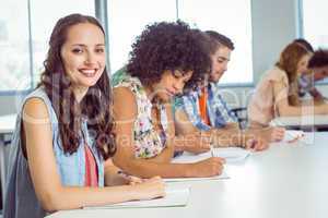 Fashion student taking notes in class