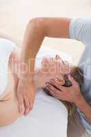 Woman receiving neck massage