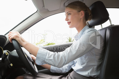 Businesswoman sitting in drivers seat