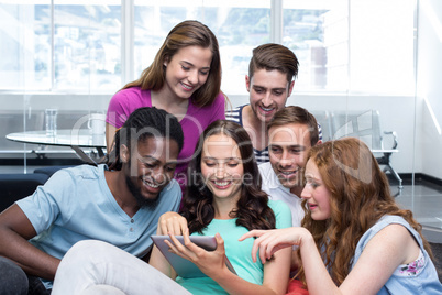 Collegue students using digital tablet