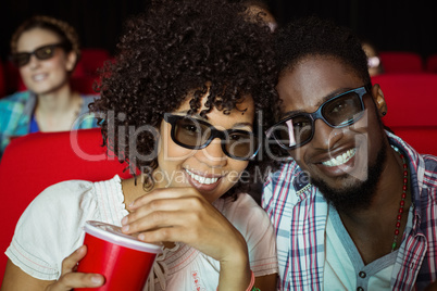 Young couple watching a 3d film