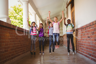 School kids running in school corridor