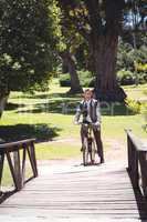 Businessman riding bike in the park