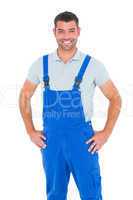 Portrait of happy repairman in overalls