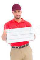 Delivery man giving pizza boxes