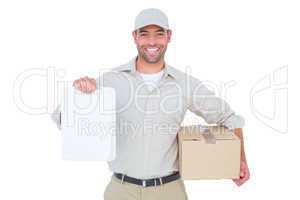 Delivery man with cardboard box showing clipboard