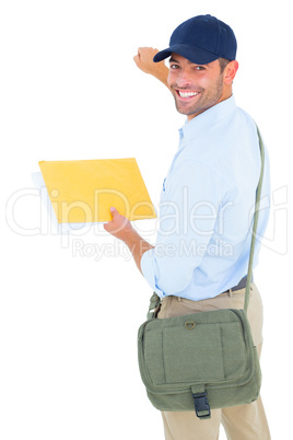 Smiling postman with letter knocking on white background