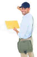 Smiling postman with letter knocking on white background