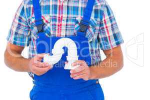 Plumber holding sink pipe on white background