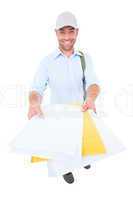 Happy postman delivering lettes on white background