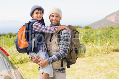 Father and son hiking in the mountains