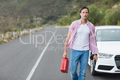 Man walking and holding petrolcan