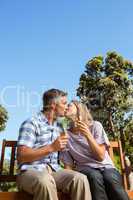 Couple relaxing in the park with wine