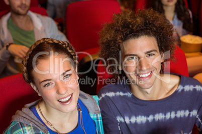 Young couple watching a film