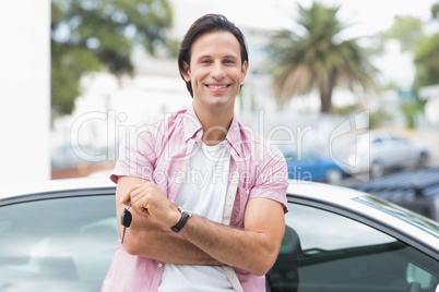 Man smiling and holding key