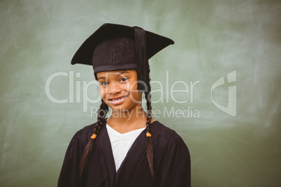 Little girl wearing graduation robe
