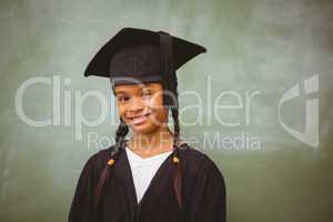 Little girl wearing graduation robe