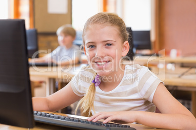 Cute pupil in computer class