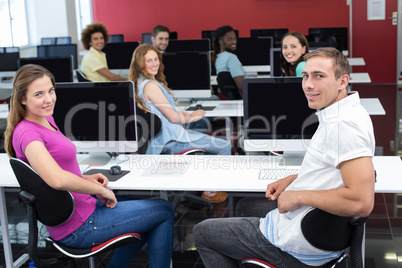 Smiling students in computer class Smiling students in computer class
