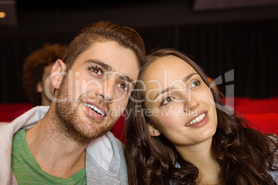 Young couple watching a film