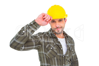 Smiling Handyman holding helmet