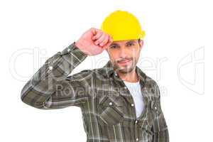 Smiling Handyman holding helmet