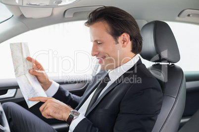 Businessman reading a map