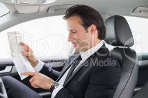 Businessman reading a map