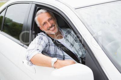 Man driving and smiling