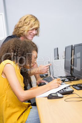 Students working on computer in classroom