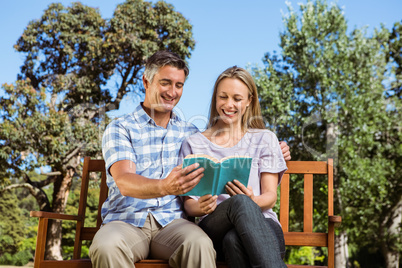 Couple relaxing in the park on bench